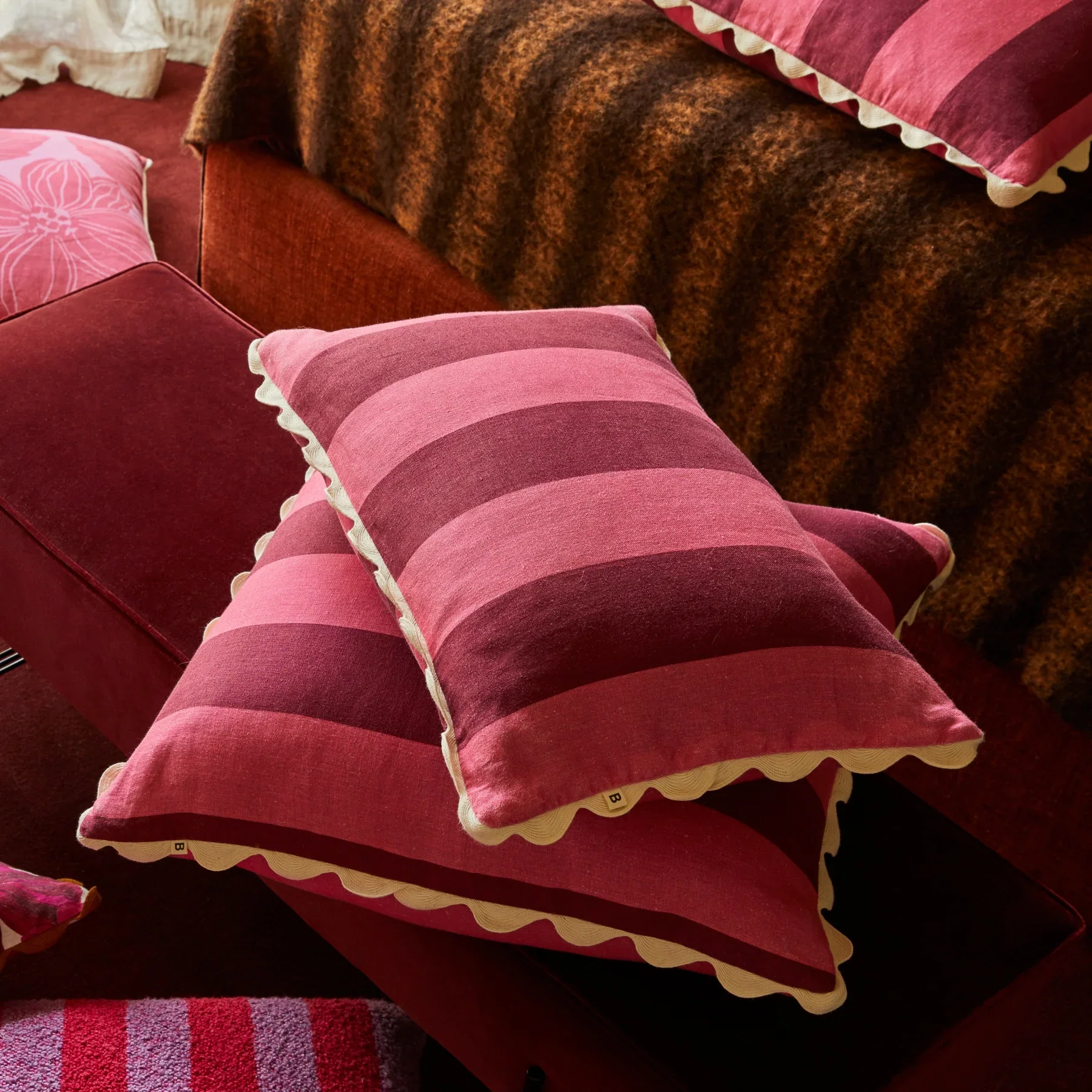 C3007-Big-Stripe-Cerise-60x40cm-Linen-Cushion-Styled-1.webp